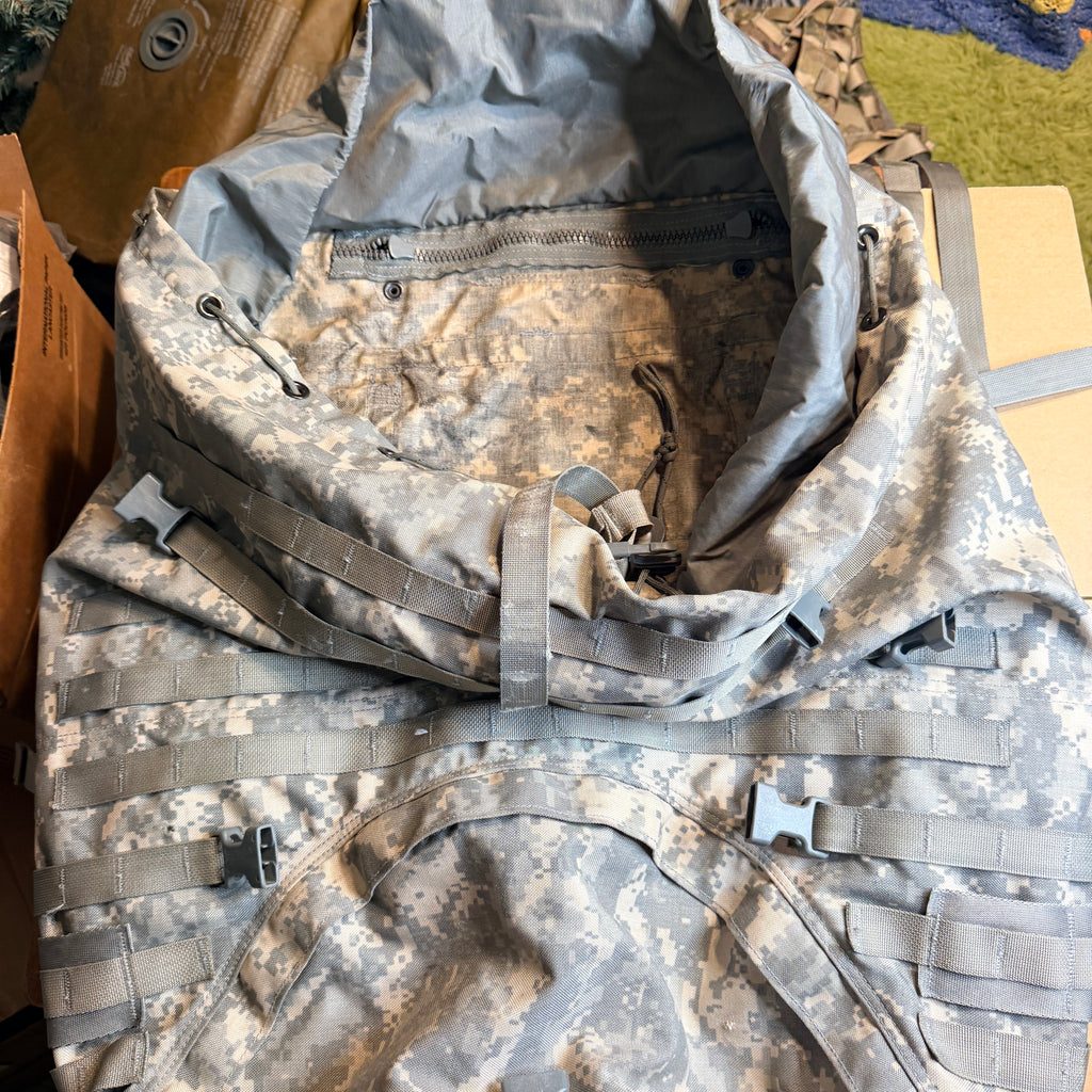 A military-style backpack in digital camouflage pattern,